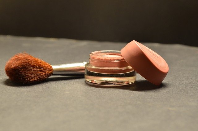 Compact A compact with a brush